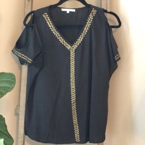 Black top with gold accents